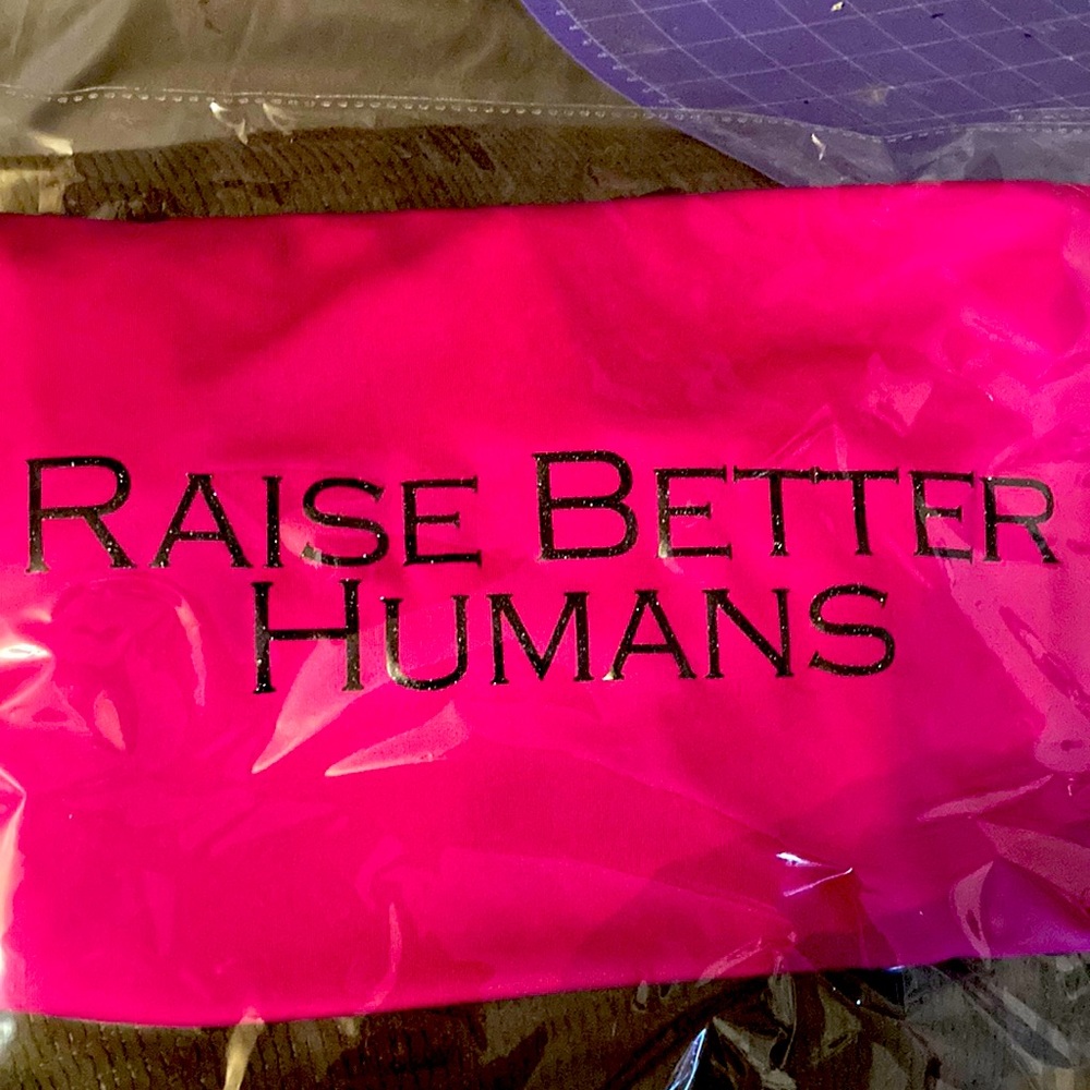 Bright pink and sparkly black raise better humans shirt